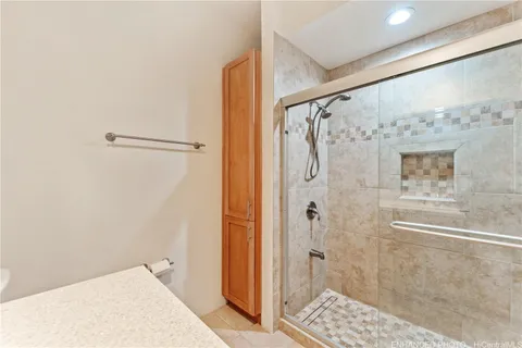 a bathroom with a shower and a sink