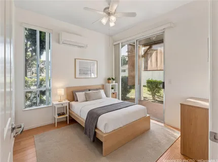 a bedroom with a large bed and a window