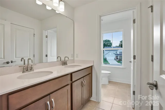 an aerial view of a house with garden space and street view