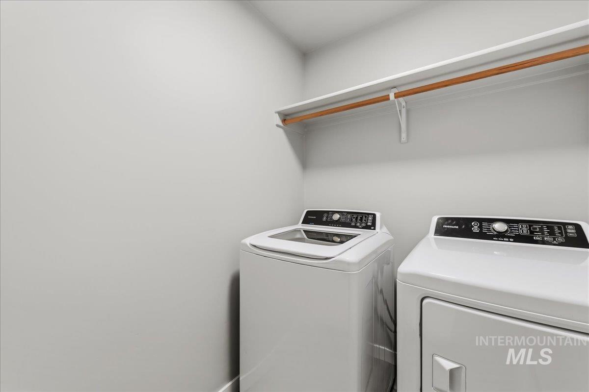 12509 West Victory Road Boise, ID 83709 - Photo 17 of 23 Laundry area featuring a built-in shelf with a hanging rod