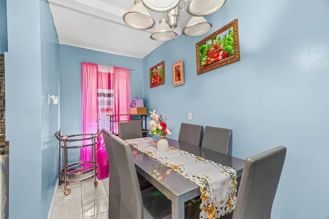 a bed sitting in a bedroom next to a wooden cabinet