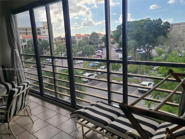 a view of a balcony with furniture