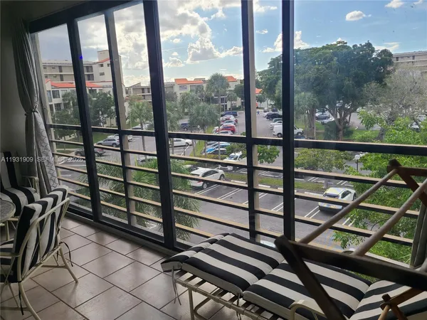 a view of a balcony with furniture
