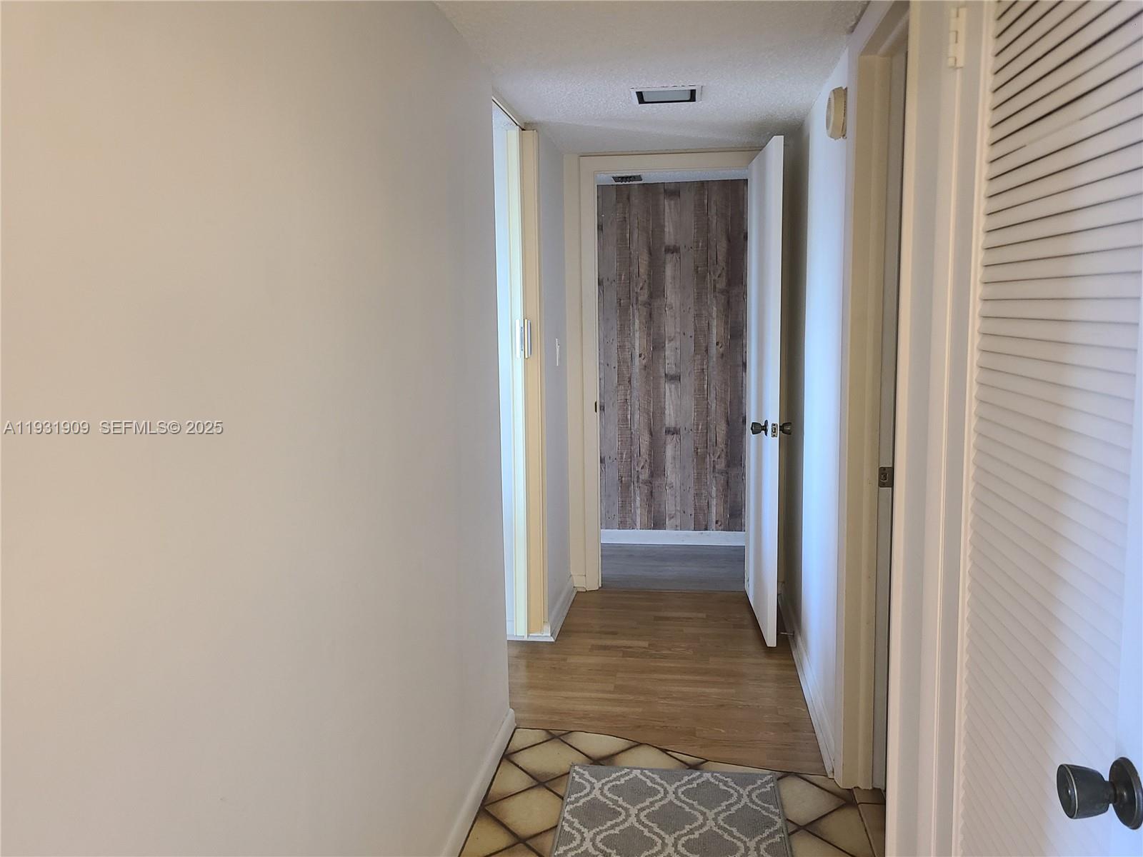 2306 South Cypress Bend Drive, Unit 418 Pompano Beach, FL 33069 - Photo 7 of 18 a view of a hallway