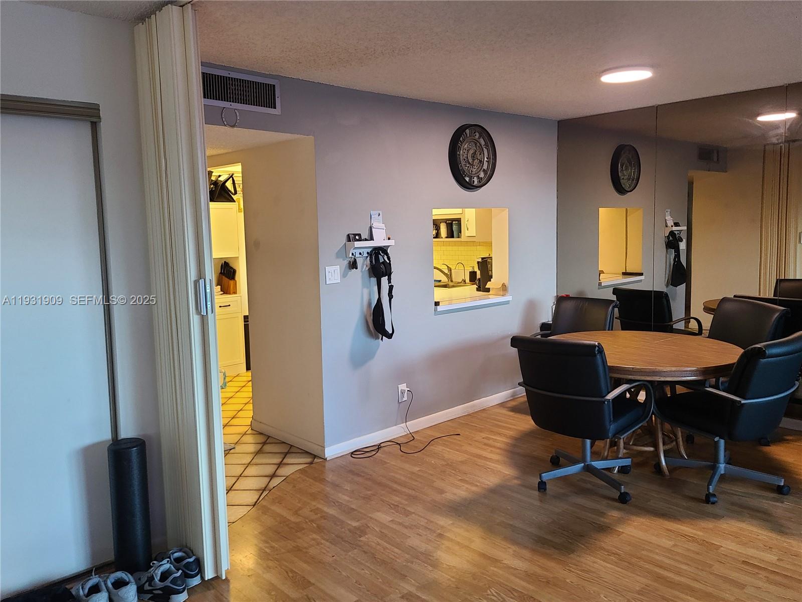 2306 South Cypress Bend Drive, Unit 418 Pompano Beach, FL 33069 - Photo 8 of 18 a view of a workspace with furniture and a window