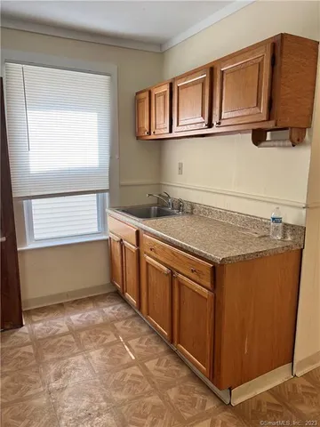 a kitchen with a stove and a sink