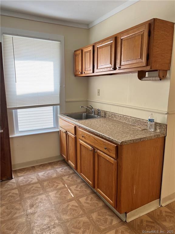 a kitchen with a stove and a sink