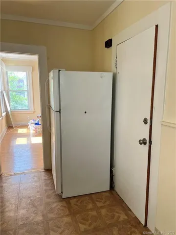 a view of a storage & utility room with a window