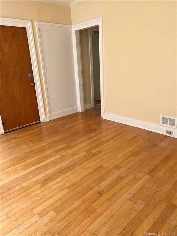 259 Humphrey Street, Unit 2 New Haven, CT 06511 - Photo 4 of 13 a view of an empty room with wooden floor