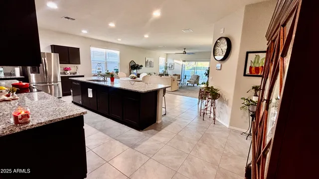 a bed room with a bed and a chair