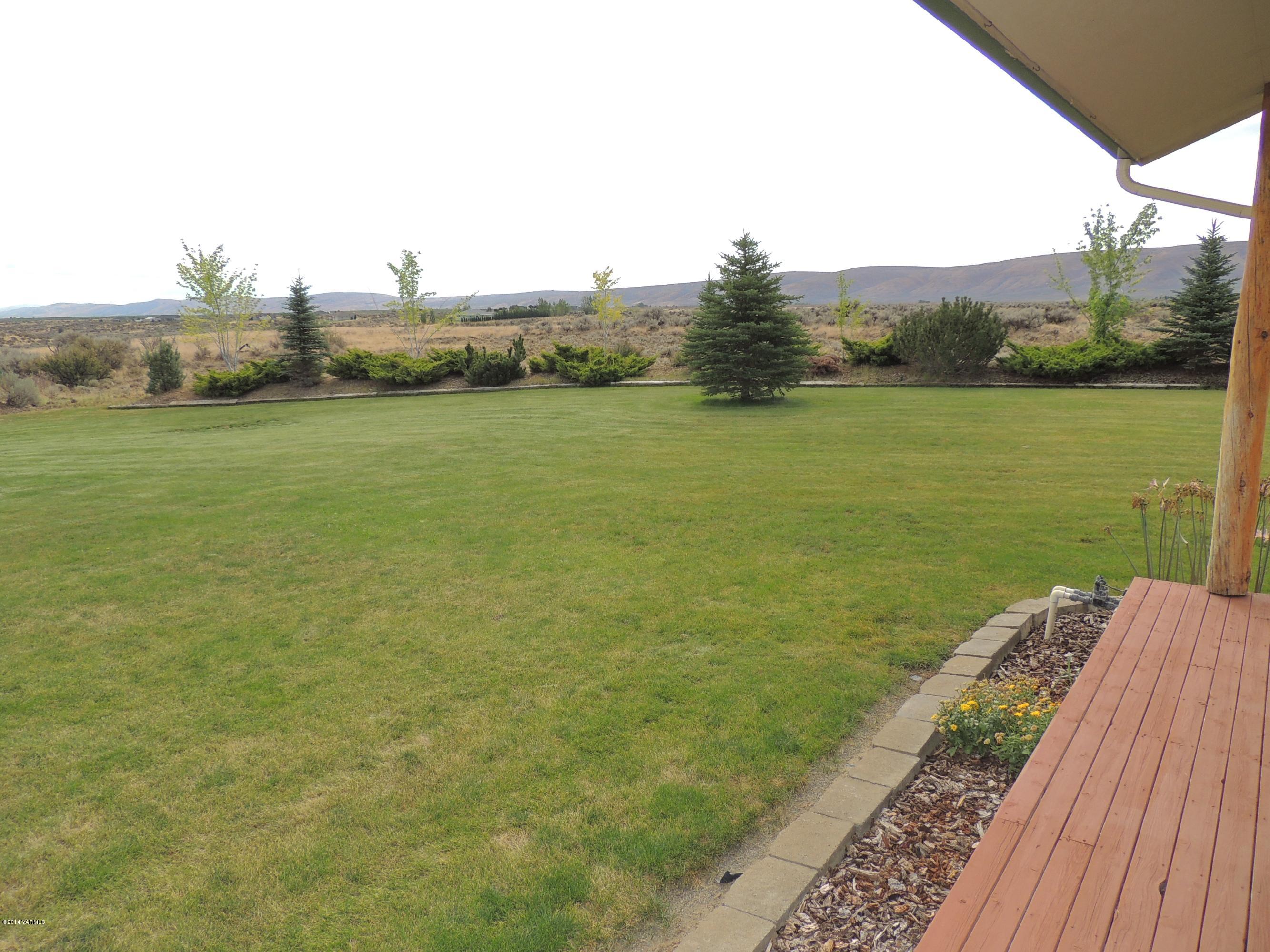 270 Red Tail Road Yakima, WA 98908 - Photo 21 of 69 a view of a lake with a yard