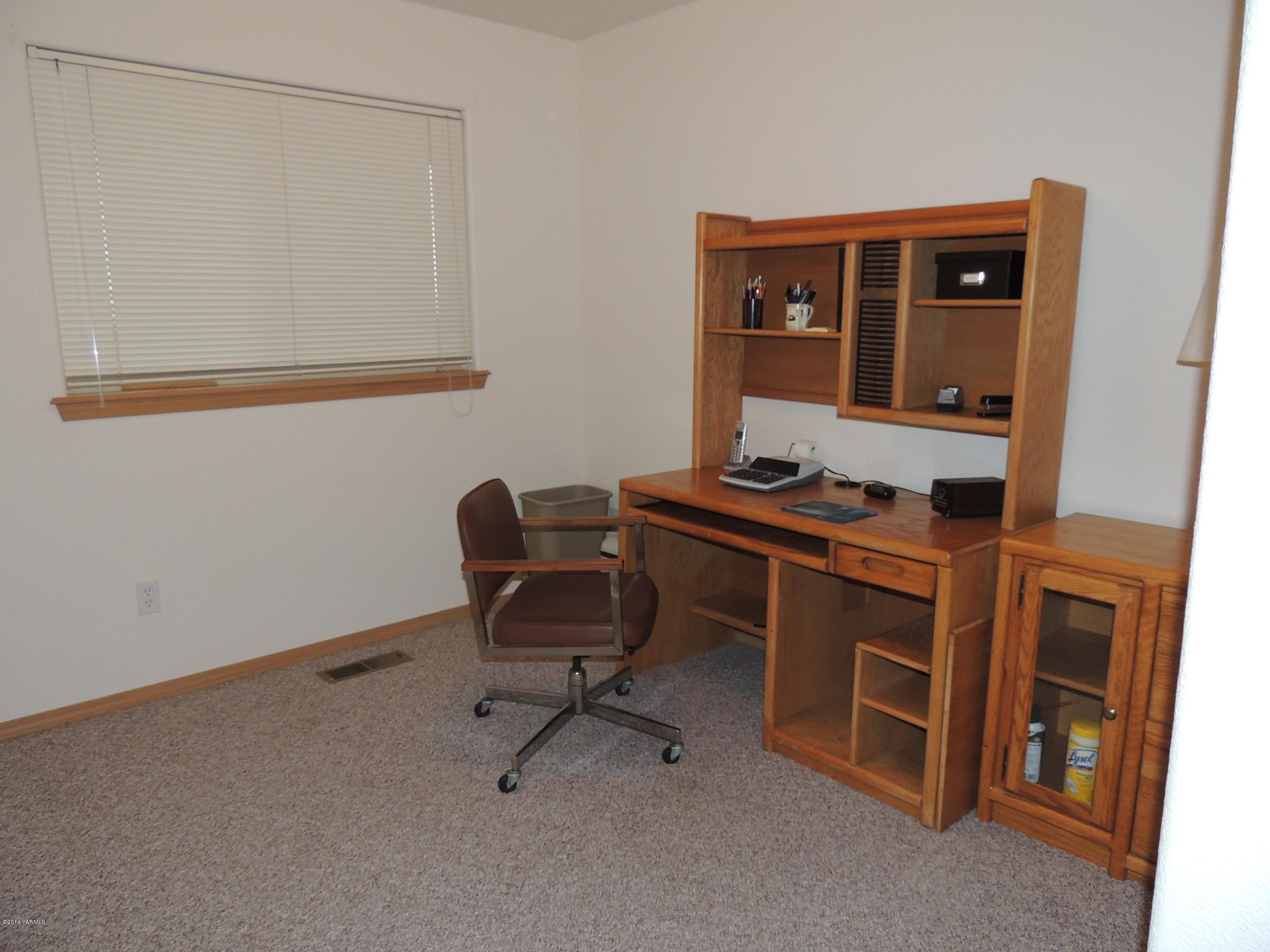 270 Red Tail Road Yakima, WA 98908 - Photo 5 of 69 a view of workspace with wooden floor and windows