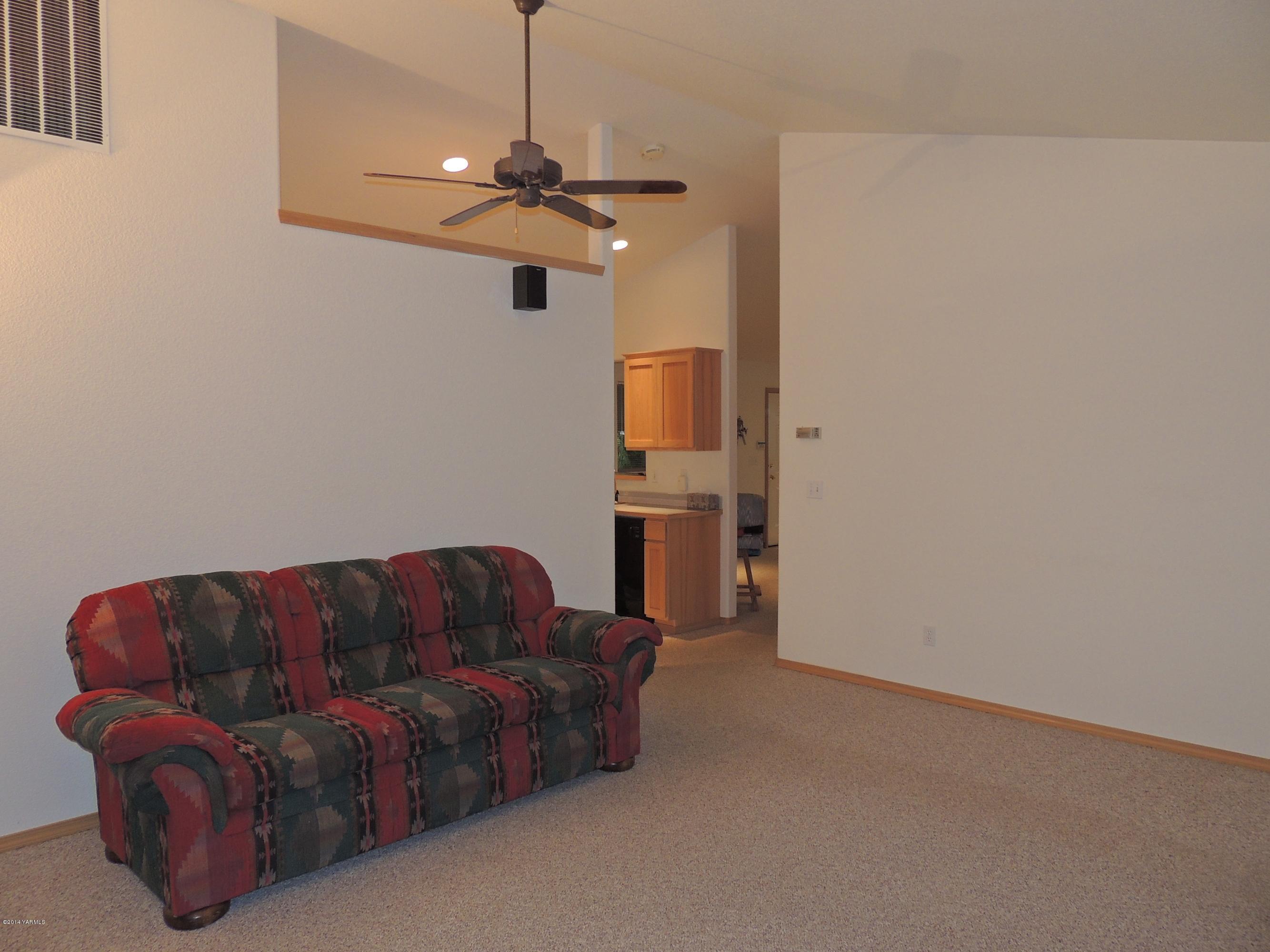 270 Red Tail Road Yakima, WA 98908 - Photo 41 of 69 a living room with furniture and a chandelier