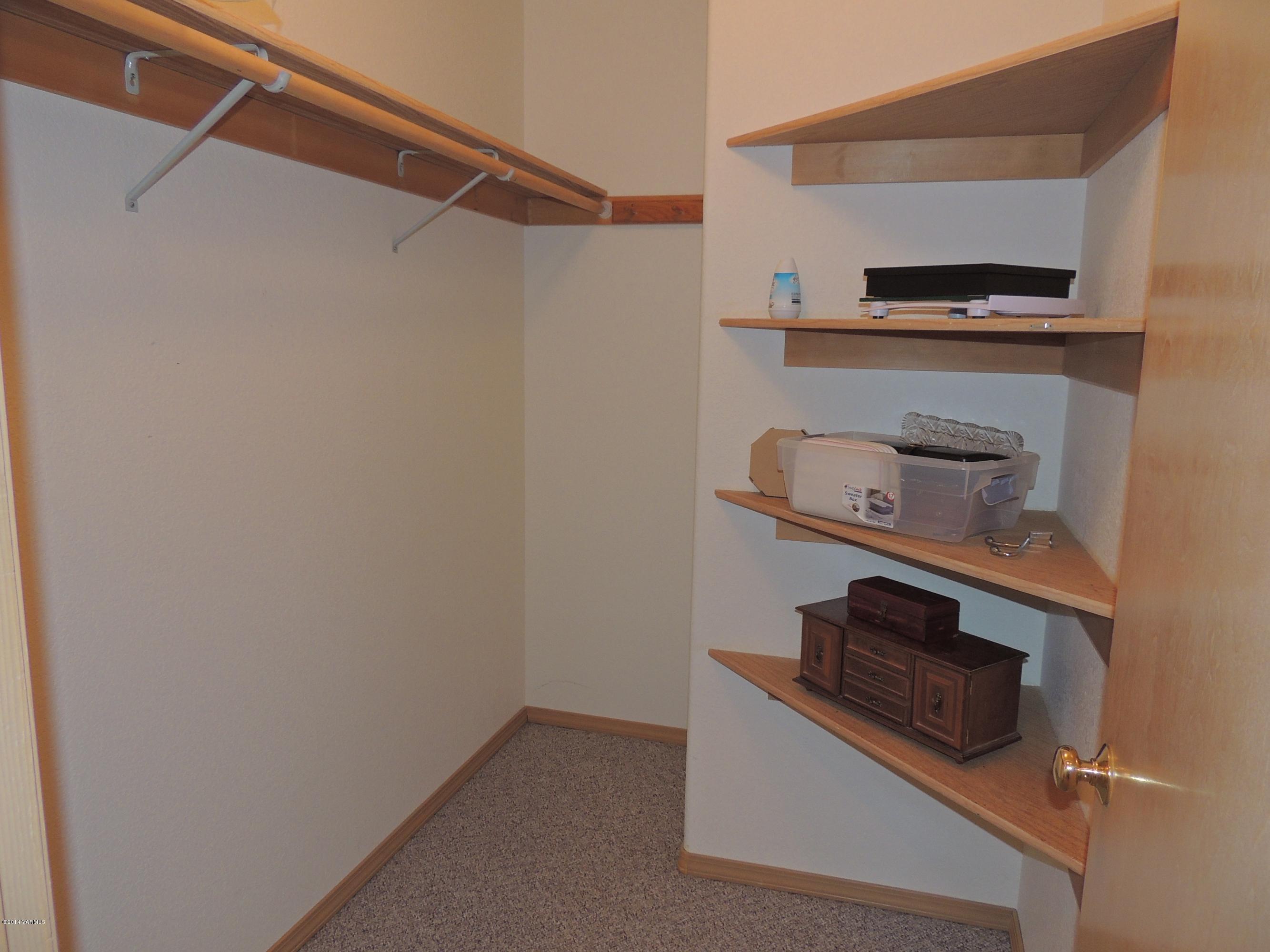270 Red Tail Road Yakima, WA 98908 - Photo 46 of 69 a utility room with dryer and white cabinets