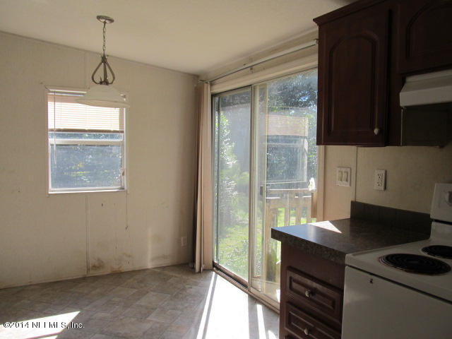 830 Gregory Road Jacksonville, FL 32234 - Photo 23 of 31 KITCHEN EAT-IN AREA & REAR SLIDER