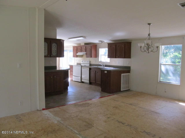 830 Gregory Road Jacksonville, FL 32234 - Photo 24 of 31 DINING AREA & VIEW OF KITCHEN