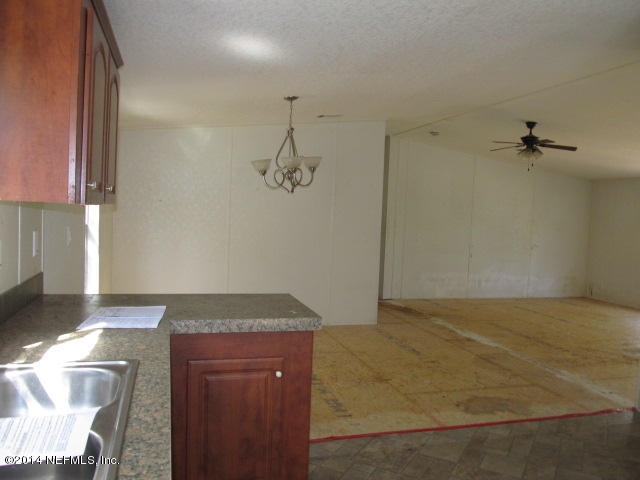 830 Gregory Road Jacksonville, FL 32234 - Photo 25 of 31 KITCHEN & VIEW OF DINING AREA