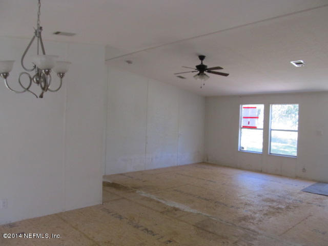 830 Gregory Road Jacksonville, FL 32234 - Photo 27 of 31 DINING ROOM & VIEW OF LIVING ROOM