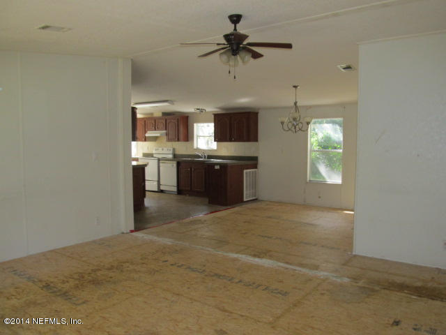 830 Gregory Road Jacksonville, FL 32234 - Photo 3 of 31 LIVING ROOM, DINING AREA & KITCHEN