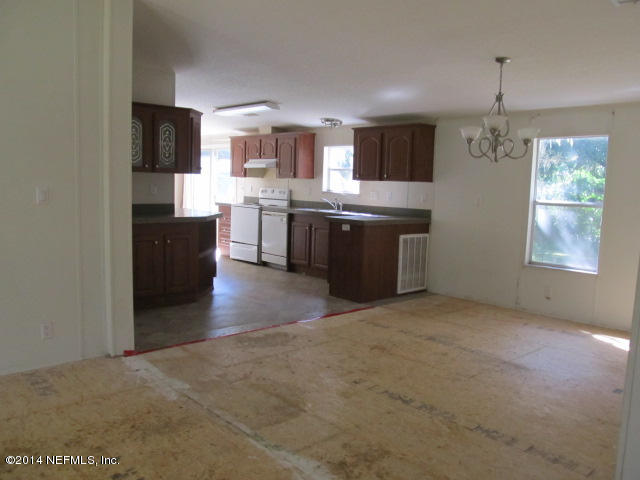 830 Gregory Road Jacksonville, FL 32234 - Photo 5 of 31 DINING AREA & VIEW OF KITCHEN