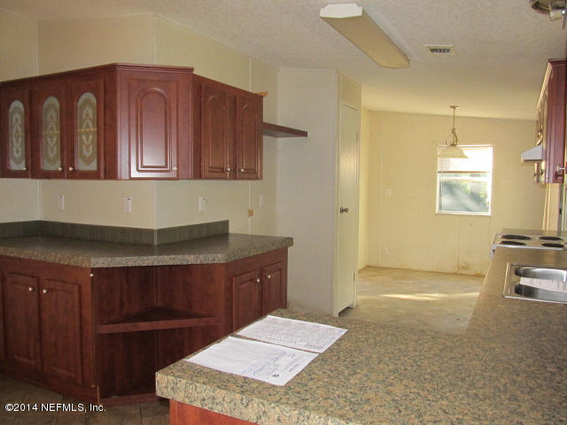 830 Gregory Road Jacksonville, FL 32234 - Photo 9 of 31 KITCHEN & BUILT-IN CHINA CABINET