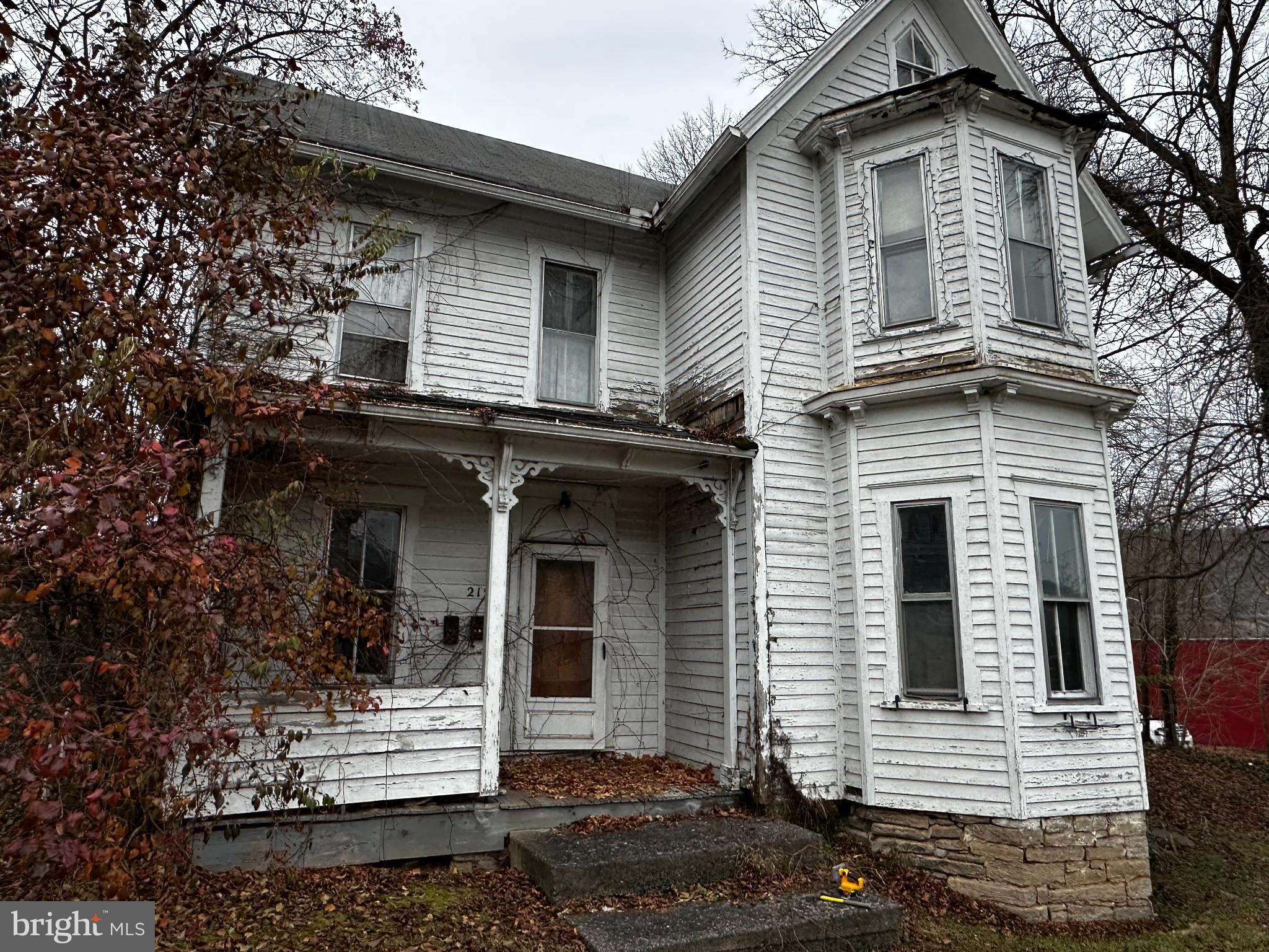 215 South Spring Street Bellefonte, PA 16823 - Photo 2 of 13 a front view of a house with a yard