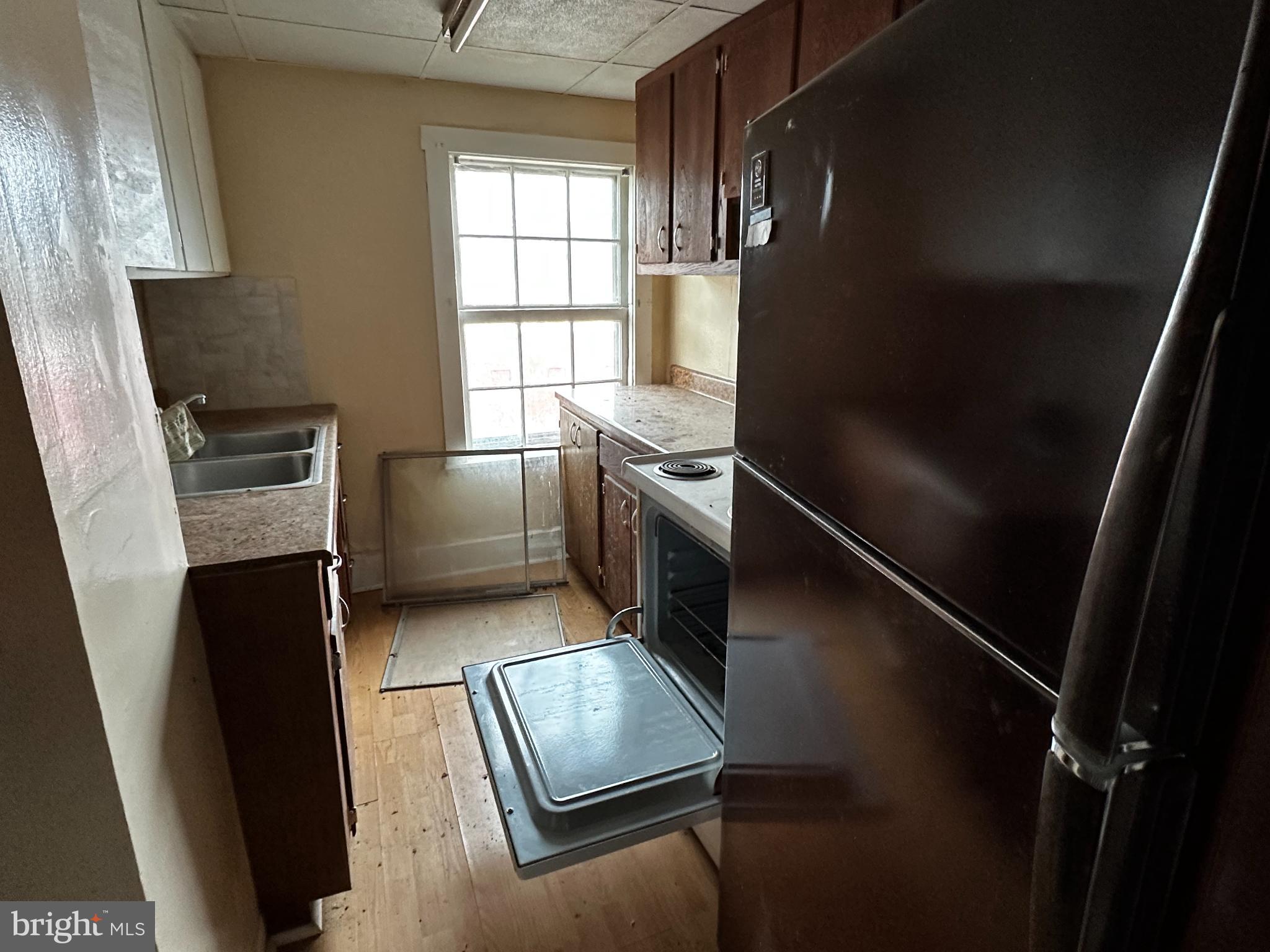 215 South Spring Street Bellefonte, PA 16823 - Photo 3 of 13 a kitchen with refrigerator and window