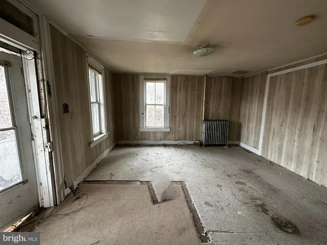 a view of empty room with windows