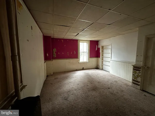 a kitchen with a refrigerator and a stove