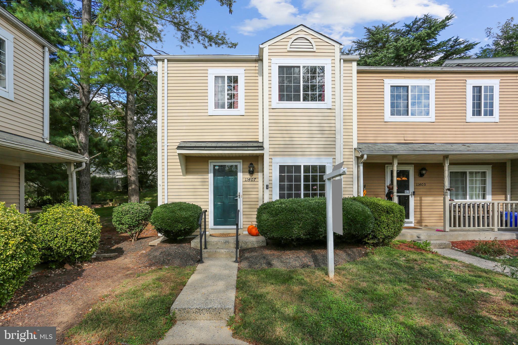 11407 Stoney Point Place Germantown, MD 20876 - Photo 1 of 85 a view of a house with a yard and a garden
