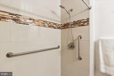 a bedroom with a bed and a chair