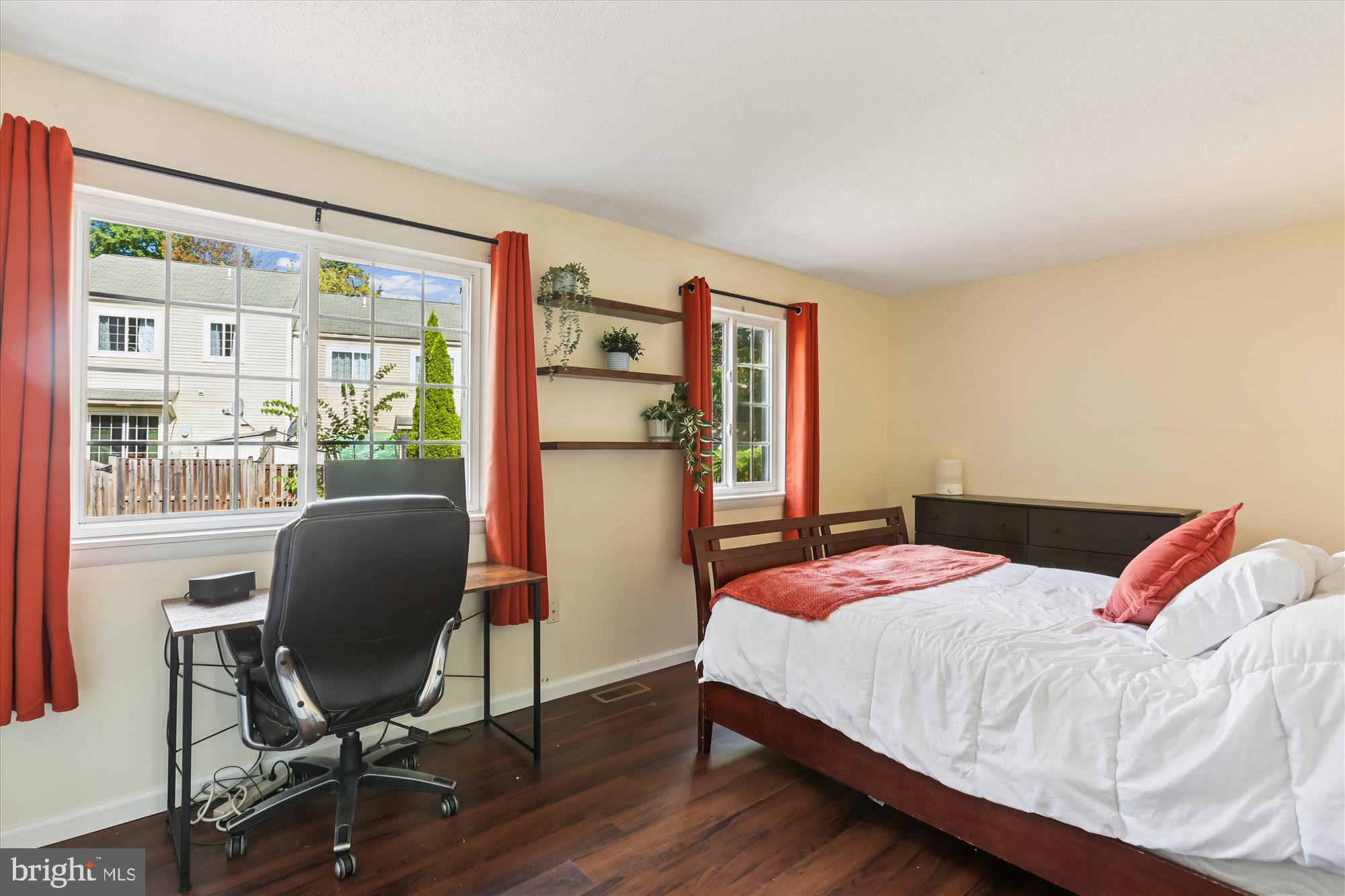 11407 Stoney Point Place Germantown, MD 20876 - Photo 20 of 85 a bedroom with a bed and a chair