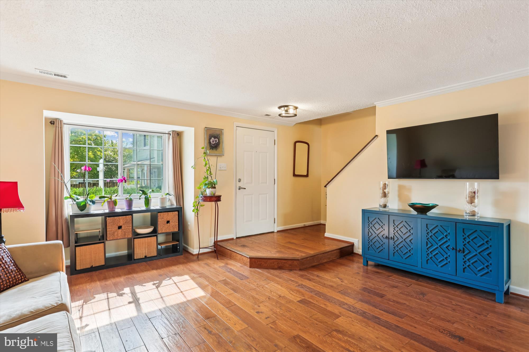 11407 Stoney Point Place Germantown, MD 20876 - Photo 2 of 85 a living room with furniture and a flat screen tv