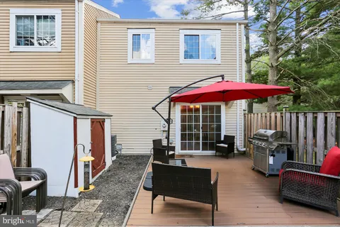 a picture of a bench in front of a wall