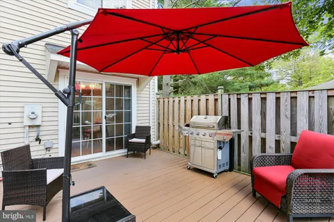 a front view of house with a garden and trees