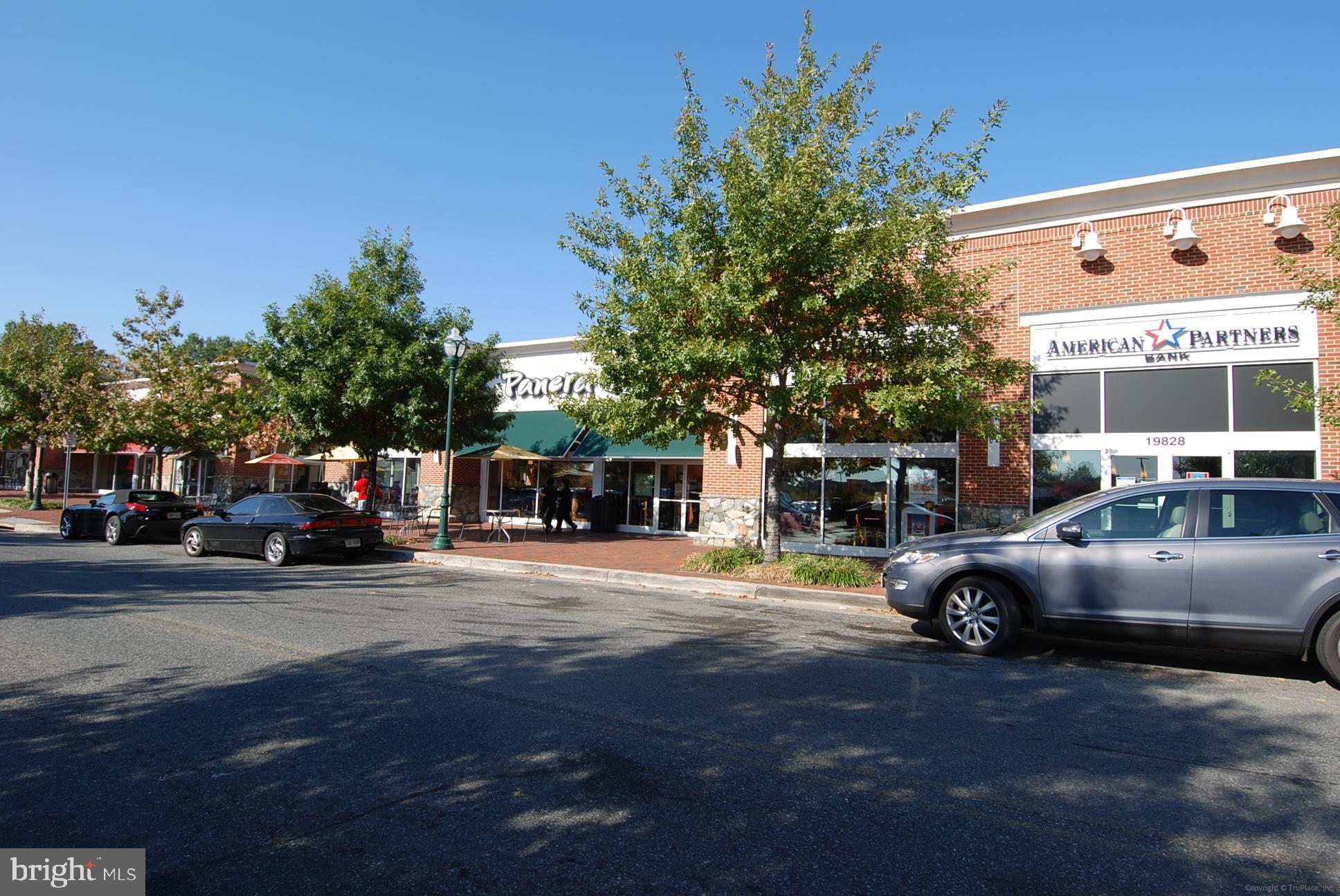 11407 Stoney Point Place Germantown, MD 20876 - Photo 54 of 85 a view of a cars park in front of a building