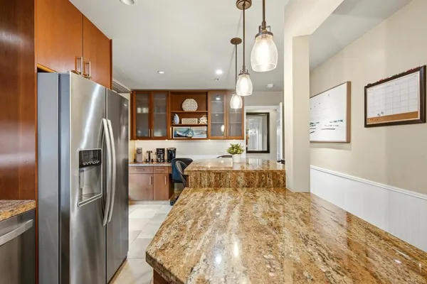 a kitchen with a sink cabinets and a window