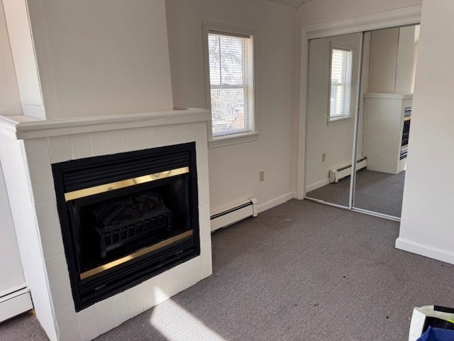 14 Dane Street, Unit 3 Everett, MA 02149 - Photo 11 of 19 a living room with a fireplace