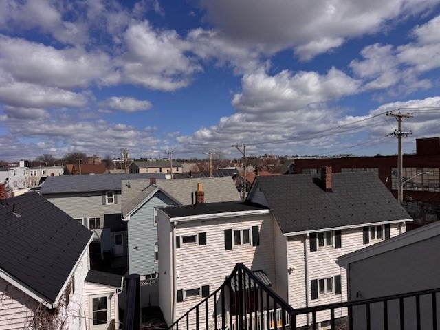 14 Dane Street, Unit 3 Everett, MA 02149 - Photo 14 of 19 an aerial view of a residential apartment building with a yard