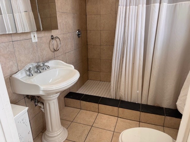 14 Dane Street, Unit 3 Everett, MA 02149 - Photo 18 of 19 a bathroom with a sink a toilet and shower