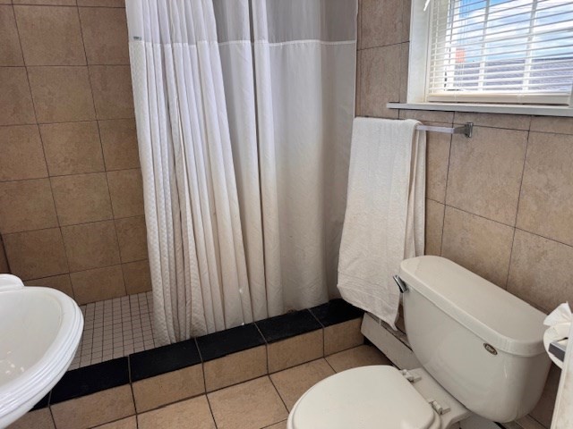 14 Dane Street, Unit 3 Everett, MA 02149 - Photo 19 of 19 a bathroom with a toilet a sink and tub