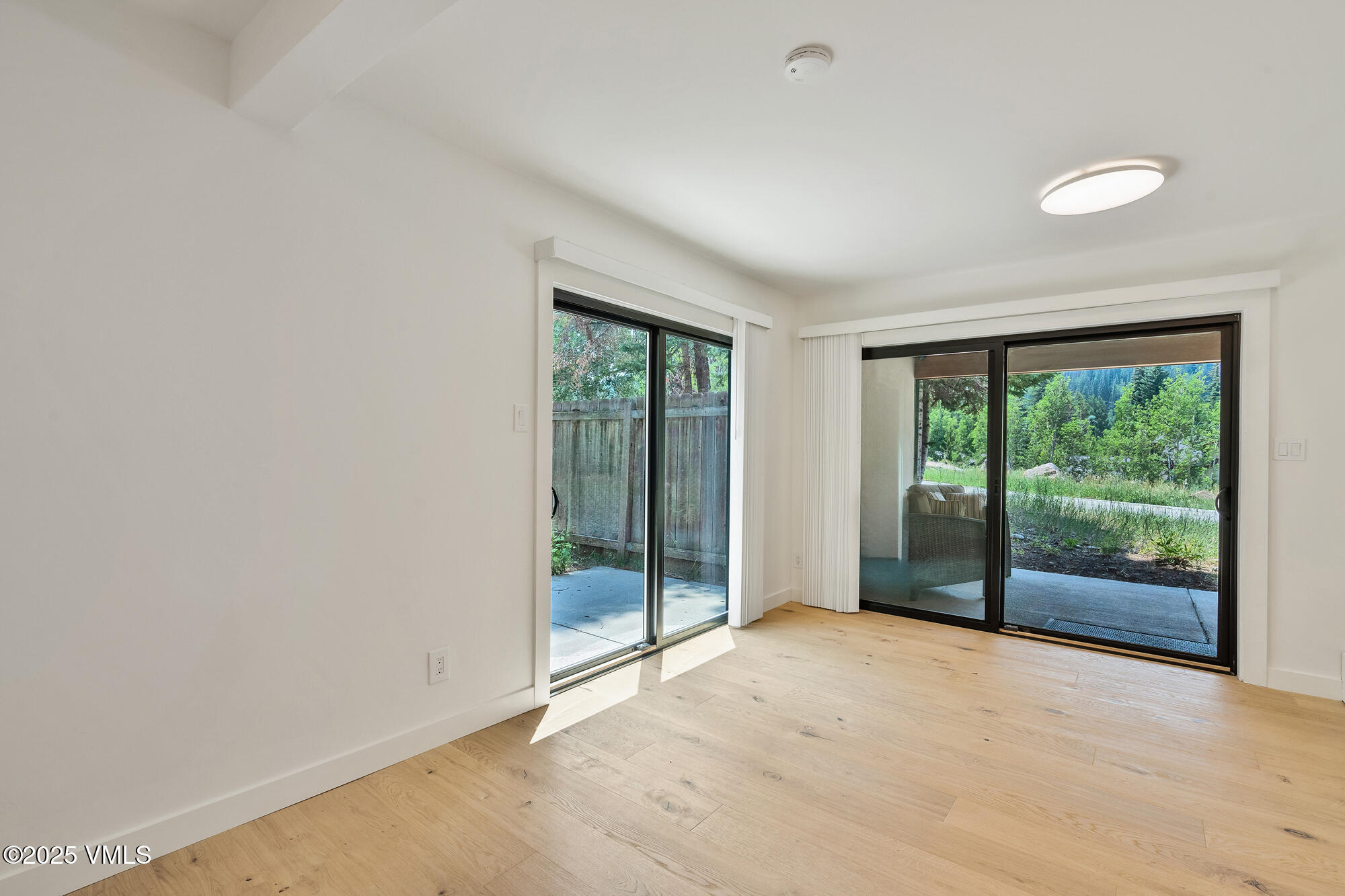 4545 Big Horn Road Vail, CO 81657 - Photo 40 of 49 a view of an empty room with wooden floor and a window