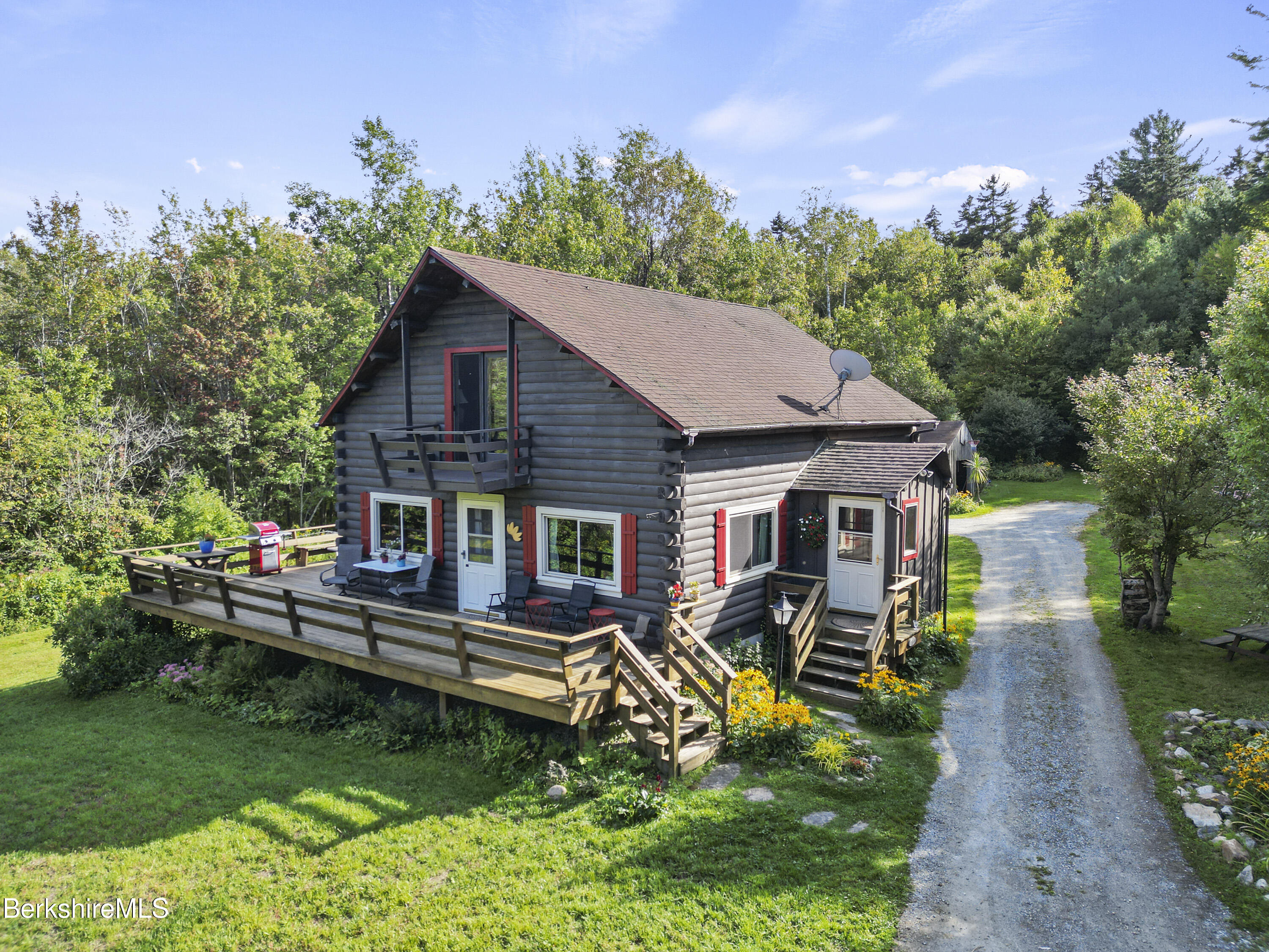 78 East Main Road Peru, MA 01235 - Photo 52 of 56 a view of a house with backyard sitting area and garden