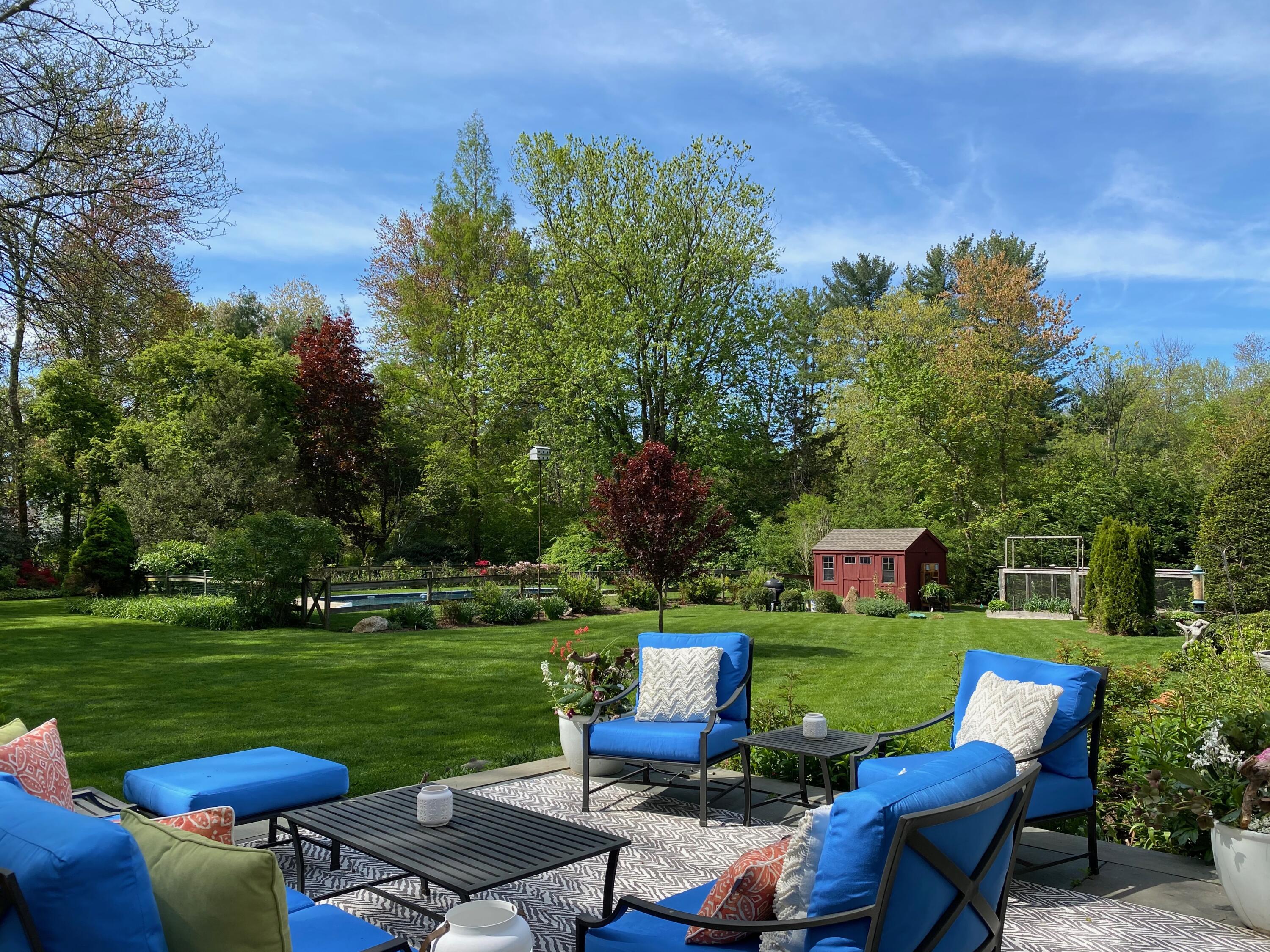 a view of a table and chairs in the garden