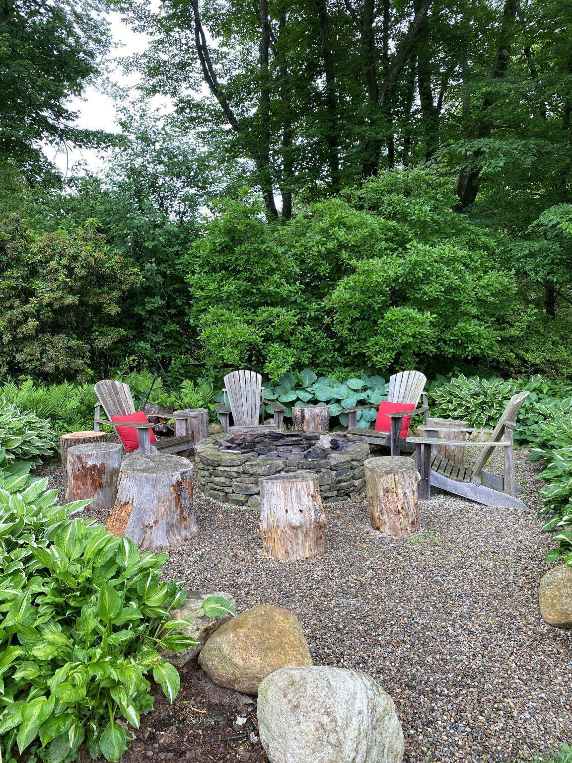 65 Conrad Road New Canaan, CT 06840 - Photo 12 of 12 a view of chair and table in backyard