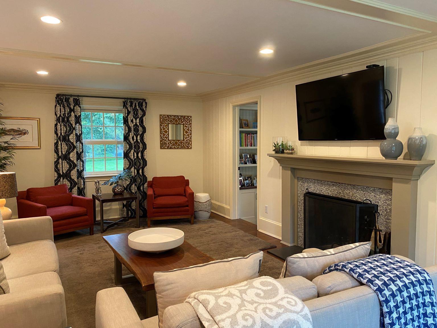 65 Conrad Road New Canaan, CT 06840 - Photo 4 of 12 a living room with furniture and a fireplace