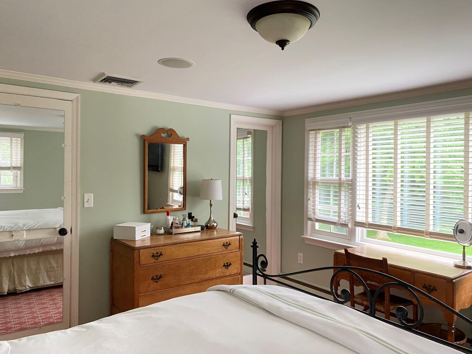 65 Conrad Road New Canaan, CT 06840 - Photo 10 of 12 a bedroom with a bed and a large window