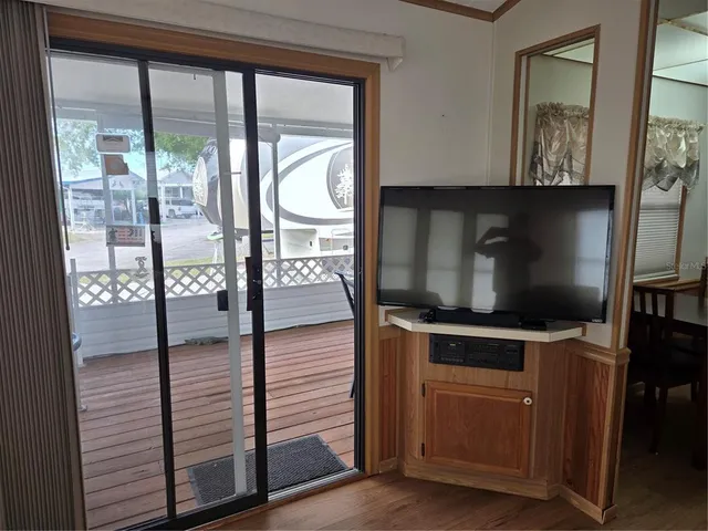 a kitchen with sink cabinets and wooden floor