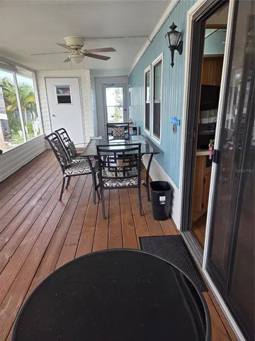 a view of a livingroom with furniture window and wooden floor