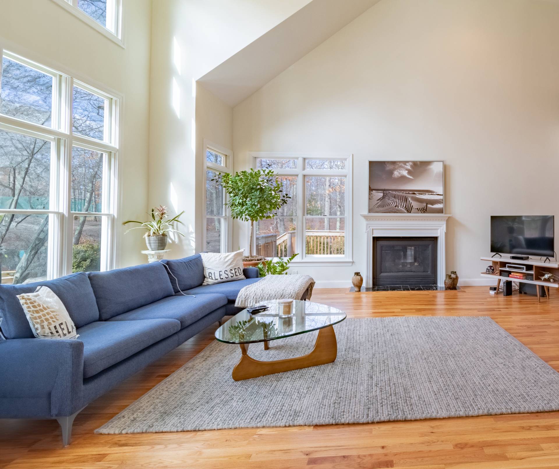 9 Ely Brook Road East Hampton, NY 11937 - Photo 3 of 22 a living room with furniture fireplace and a large window